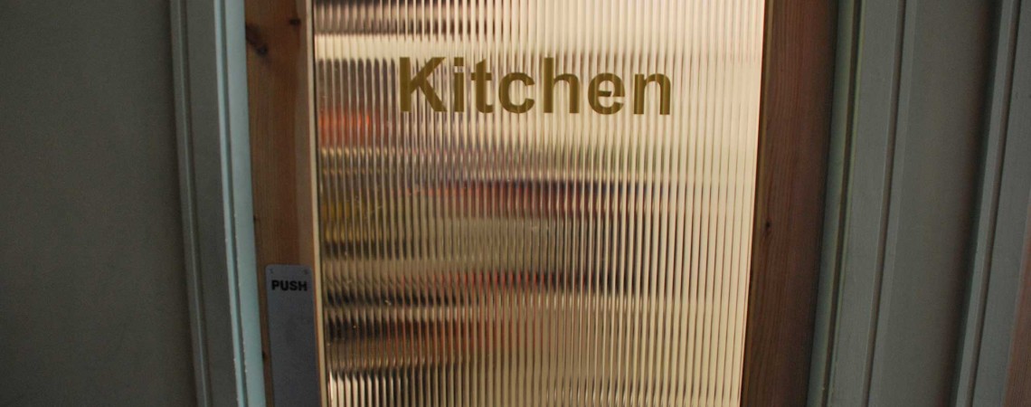 Staff only You always want the kitchen the be private but at the same time you need to see a shadow behind the door with its tinted glass.