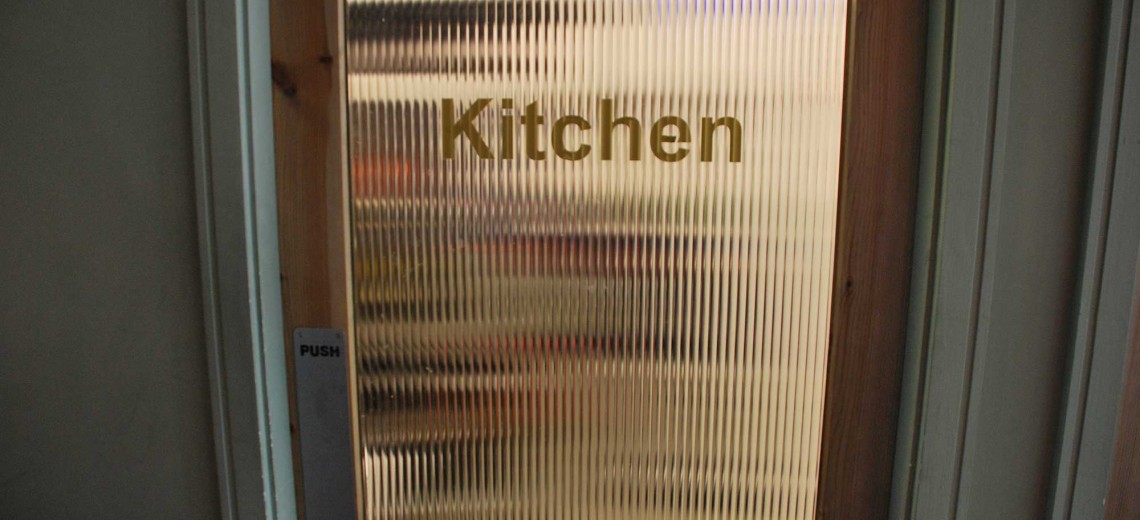 Staff only You always want the kitchen the be private but at the same time you need to see a shadow behind the door with its tinted glass.